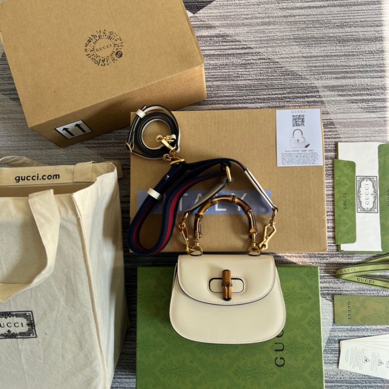 G*u*i top handle bags